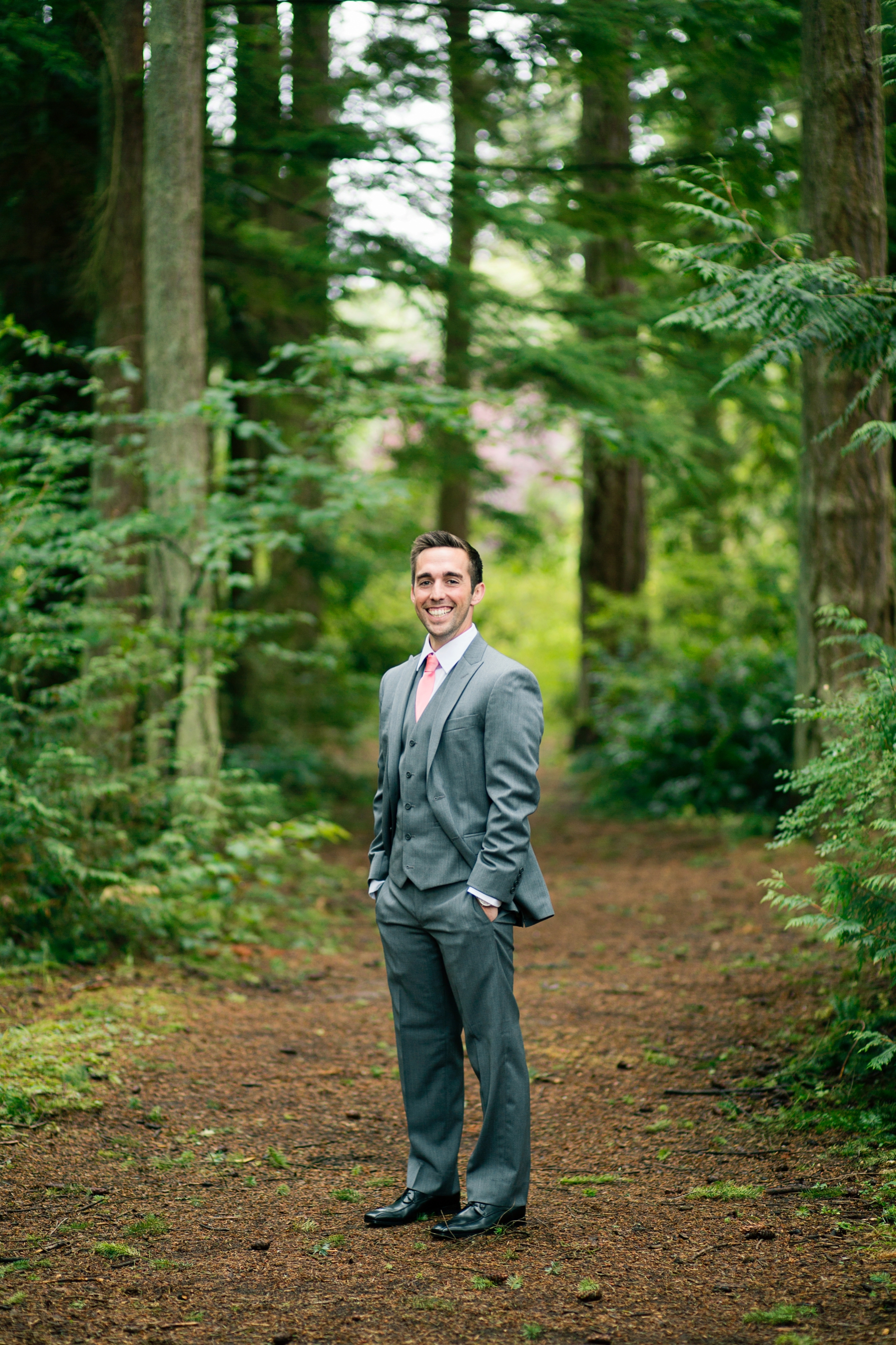24-Groom-Groomsmen-Portraits-Grey-Suit-wooded-bluff-olympic-mountains-log-cabin-Kitsap-Memorial-State-Park-Forest-Northwest-Photographer-Seattle-Wedding-Photography-by-Betty-Elaine